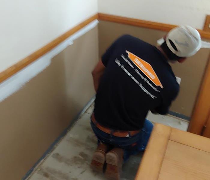 SERVPRO Reconstruction Crew Paints Wall 